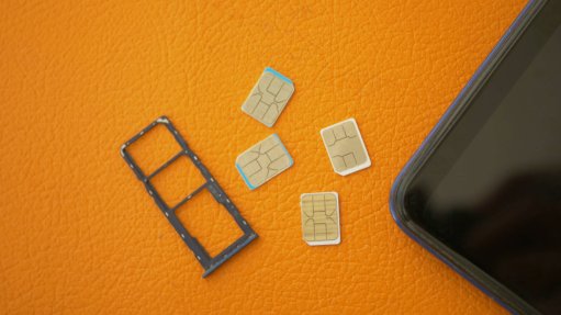 SIM cards next to a cellphone