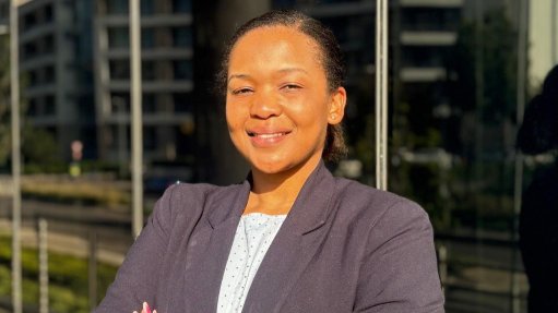 Lungelwa Kunene outside an office block 