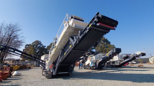 The Powertrack electric tracked mobile screen, with crushers behind