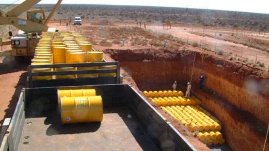 Low-level radioactive waste being emplaced in a disposal trench at Vaalputs
