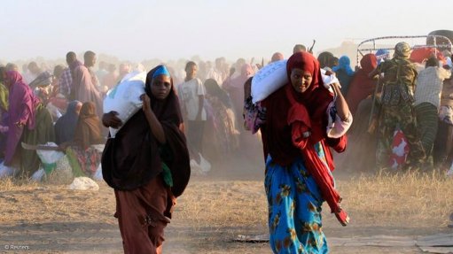 People collecting food aid