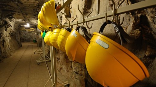 Yellow miner's helmets at mine site