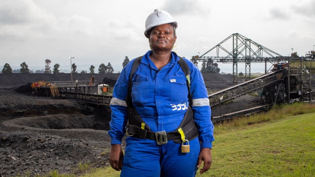 Female mine work in blue PPE on site 
