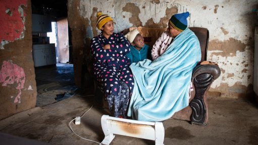 Family members at their home in De Aar trying to keep warm in winter