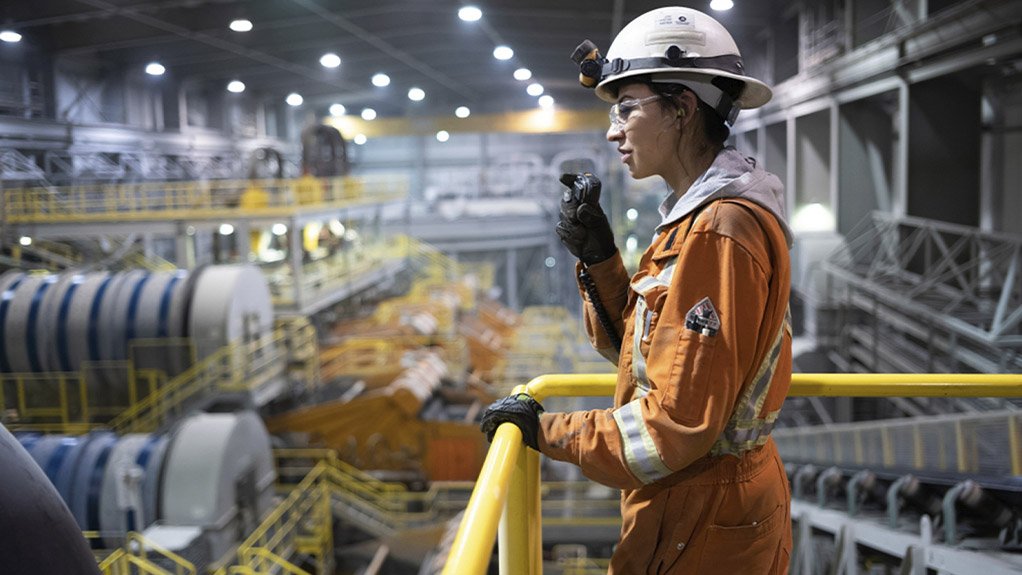 A De Beers employee communicates via radio inside the mine’s processing control room
