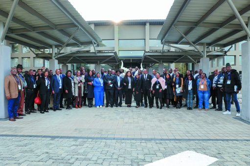 Dignitaries, government and mining officials all stood in a picture for the official handover of a suite of transformative social and labour plan by Impala
