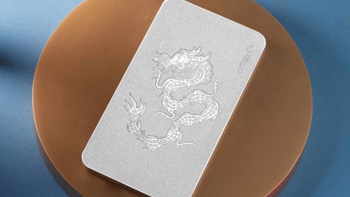 a platinum bar with fish engraved into it that end up forming a dragon