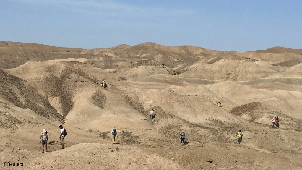 Scientists scour the landscape for fossils in the Ledi-Geraru paleoanthropological research area in the Afar Region of northeastern Ethiopia