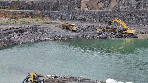 Image of a mine dam and an IPR unit in use on a mine
