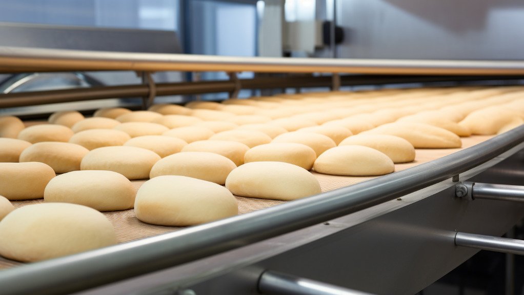 An image of dough on a conveyor