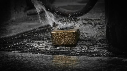 Image of gold bar being washed