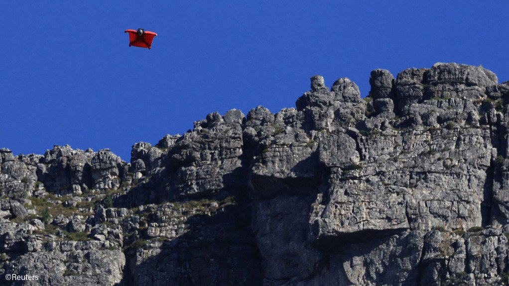 Jean-Jacques Wallis wingsuit flying near Table Mountain