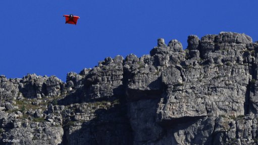 Jean-Jacques Wallis wingsuit flying near Table Mountain