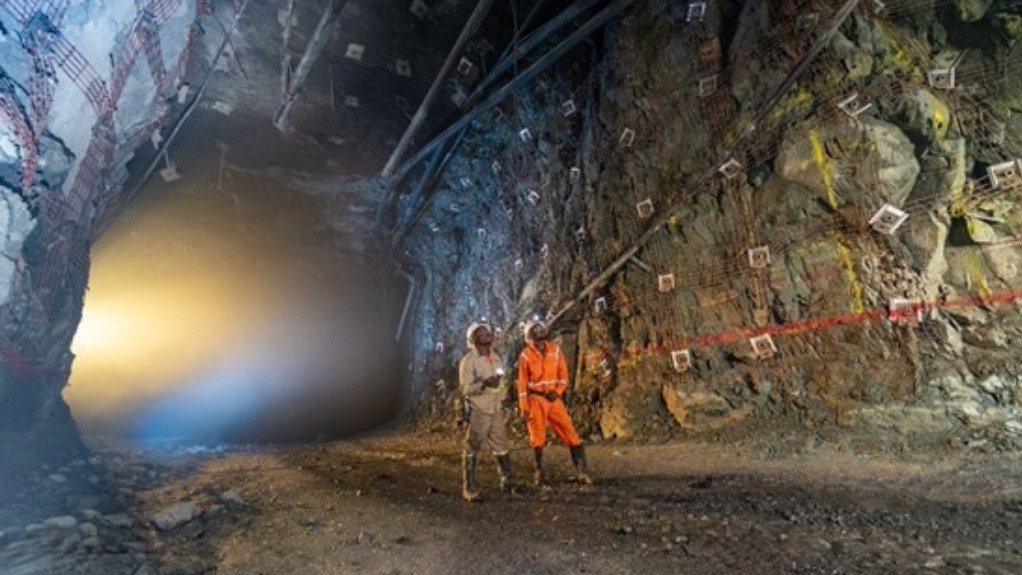 Leonard Tshikuta, Supervisor, and Manix Diur, Miner, are surveying the recently installed Osro straps, which are being used to support areas of the Kakula Mine that have had fractured sidewalls from the seismic activity reported in May.