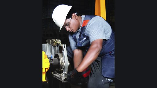 Image of a technician conducting preventive maintenance on a crane