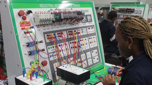 A student trains on Schneider Electric equipment