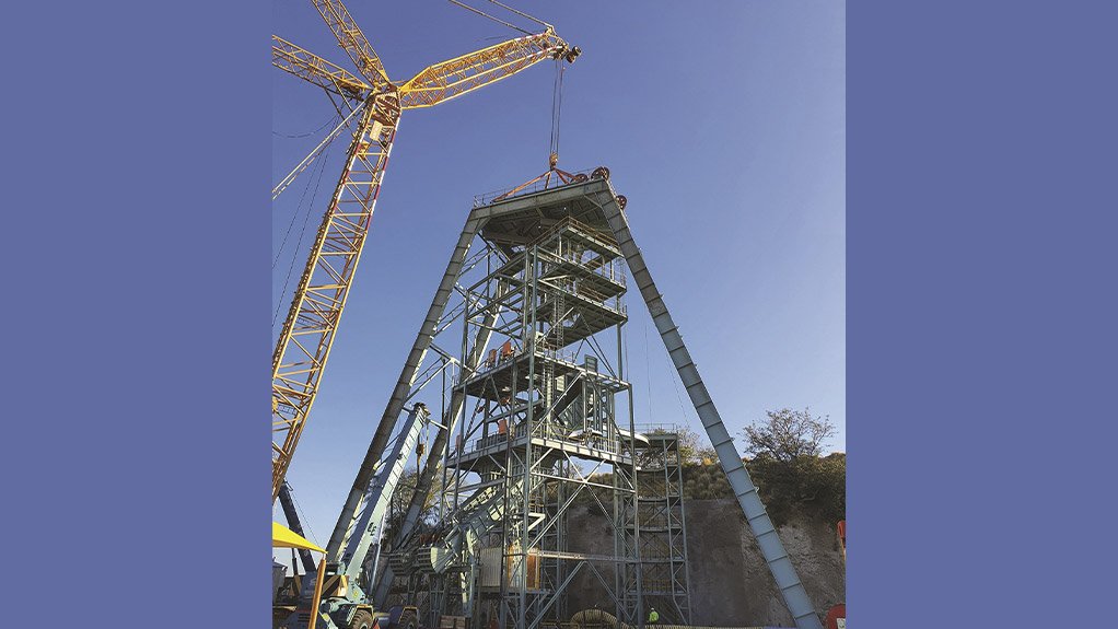 Completion of the sinking headgear at Palabora Mining Company, lowering the sheave deck using a crawler crane
