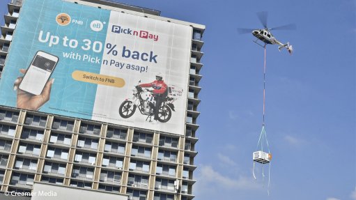The above image depicts the helicopter airlifting the HVAC units onto  roof of Bedford Centre