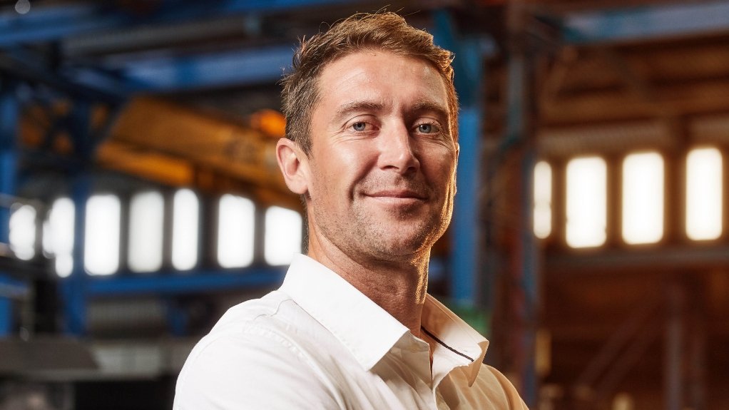 Athos Crushing & Screening sales and marketing director, crossed arms, smiling 