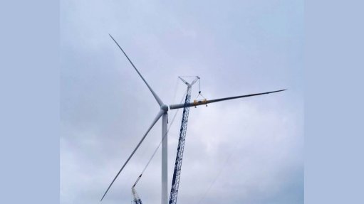 The above image depicts a wind turbine during construction