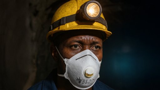 Image of a man wearing a dust masks from REIYN International