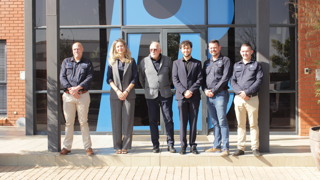 Bi and SAER team members photographed at the partnership announcement launch event