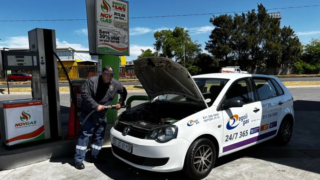 Petrol attendant with the converted VW polo