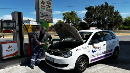 Petrol attendant with the converted VW polo