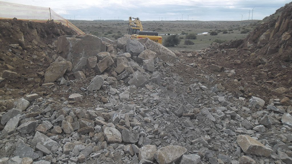 Cut-to-fill activities in progress on the De Aar 2 South Wind Energy Facility project, optimising on-site material use for road construction and turbine platform preparation