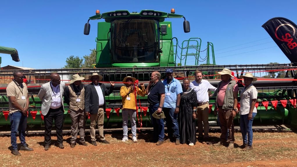MEC cuts the ribbon along with stakeholders to unveil new farming equipment