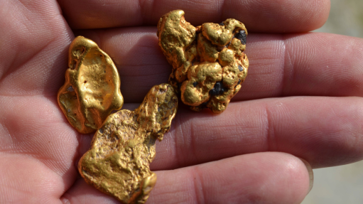 Image of gold nuggets in hand