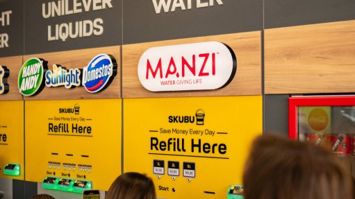 the launch of a MANZI water refilling station at a SKUBU refiling shop