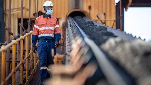 man at materials conveyor
