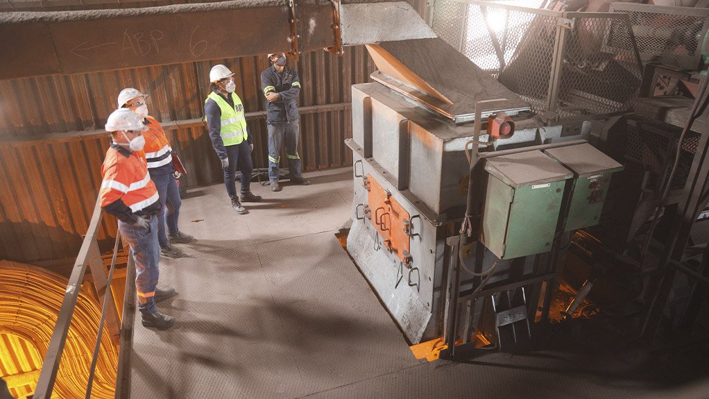 At this steel plant, a Weba transfer chute is shown managing heavy material flow while effectively lowering dust emissions in a demanding environment