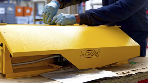 Image of an air conditioner being fitted in a factory