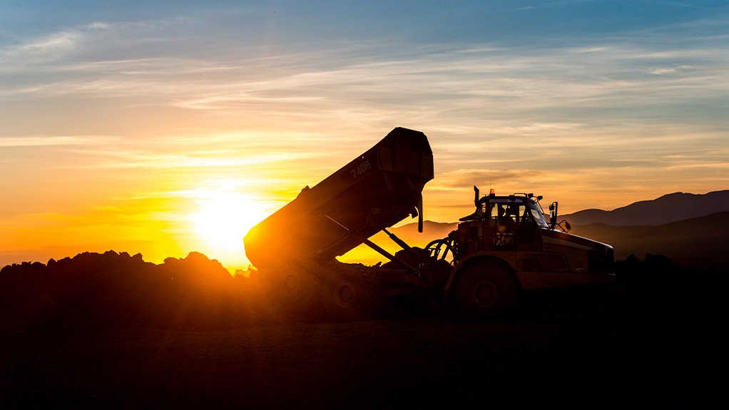 Caterpillar dump truck at sunset