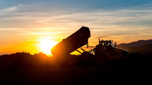 Caterpillar dump truck at sunset
