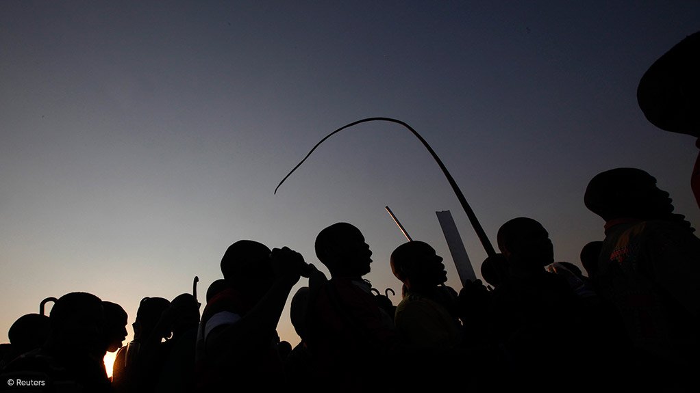 workers striking at sunset