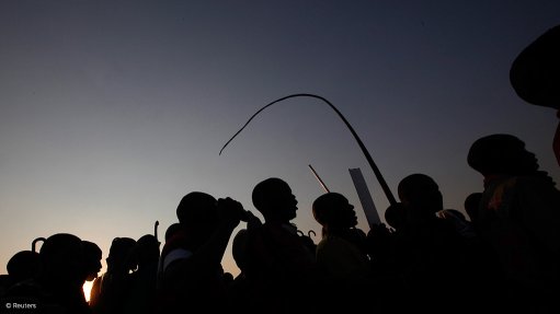 workers striking at sunset