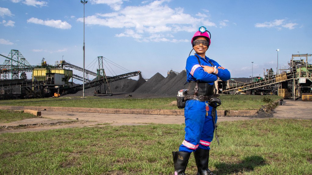 A generic image of woman standing at a mine site