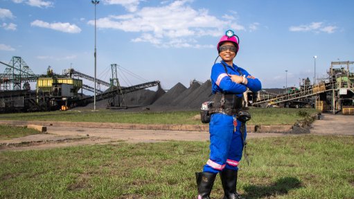 A generic image of woman standing at a mine site