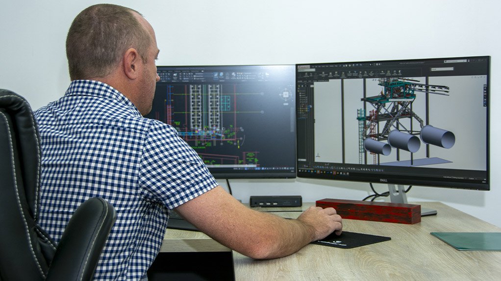 Weba Chute Systems Technical Director, Dewald Tintinger, reviewing a transfer chute as part of the company’s customised design process