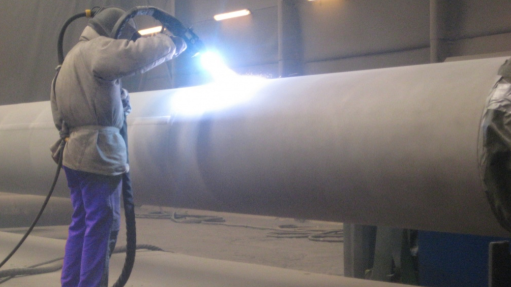 An image of an engineer using thermal zinc spray