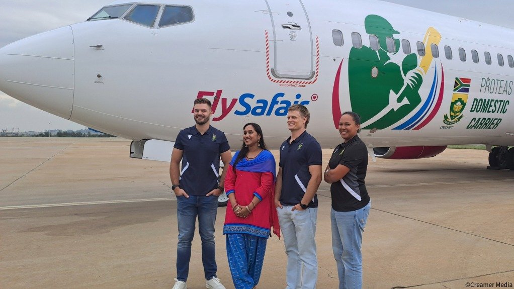 An image of FlySafair's design competition winner Dinika Naidu, with Proteas cricketers 