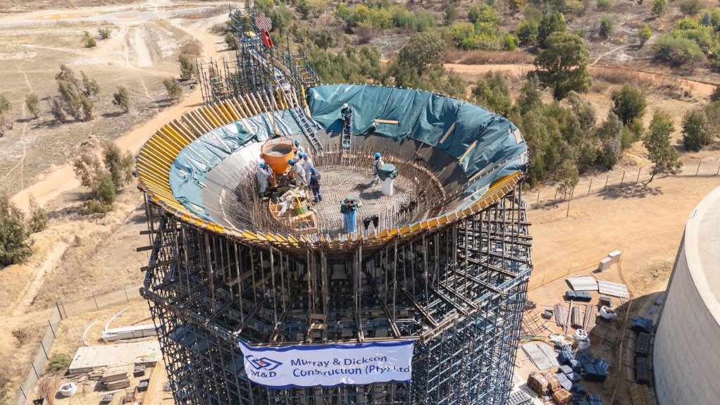 The above image depicts the water tower throughout construction