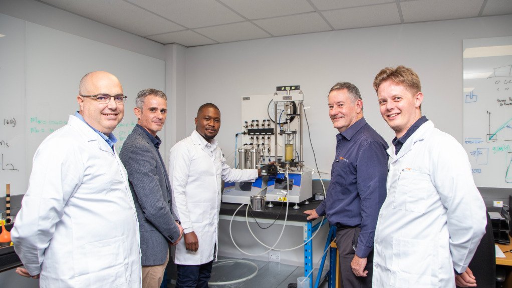 a group of scientists and geologists in a high tech lab