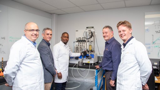 a group of scientists and geologists in a high tech lab