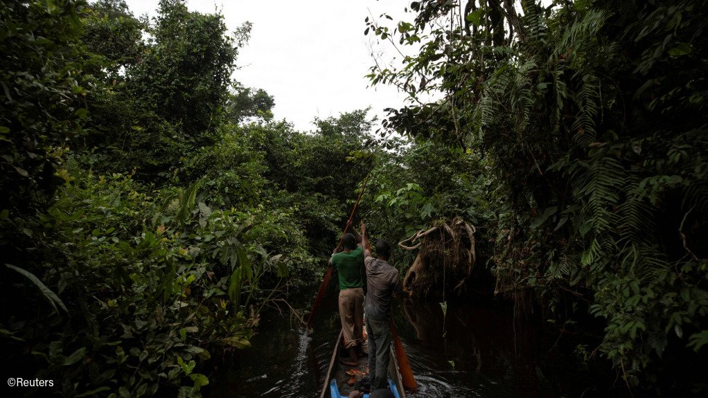 A boat on a river in the rainforests of the DRC