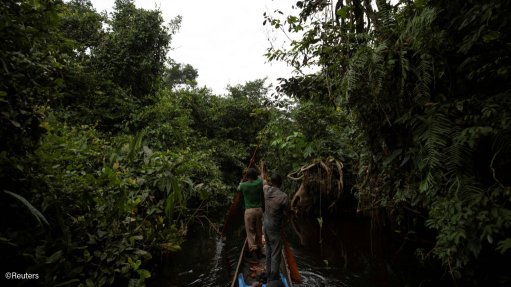 A boat on a river in the rainforests of the DRC