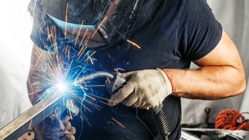 An image of a man welding